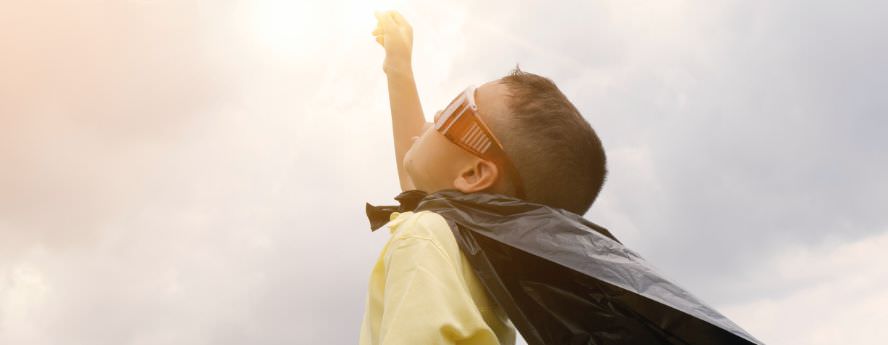 Happy And Healthy Little Boy Child Wearing Black Cap And Sunglasses Reaching For The Sky