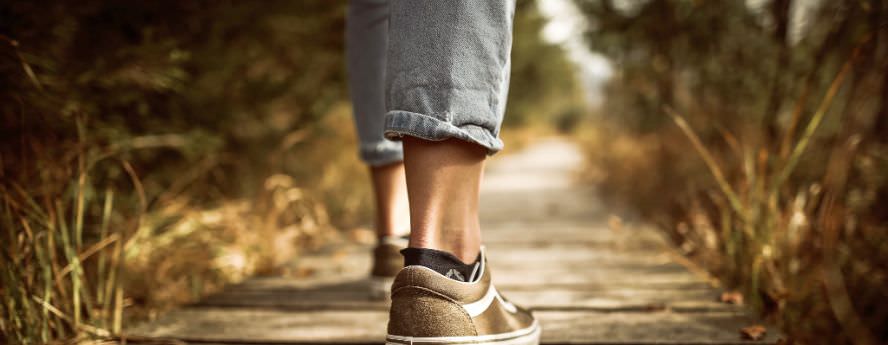 Person Walking In Nature On Wooden Path Exercising Keeping Healthy And Feet