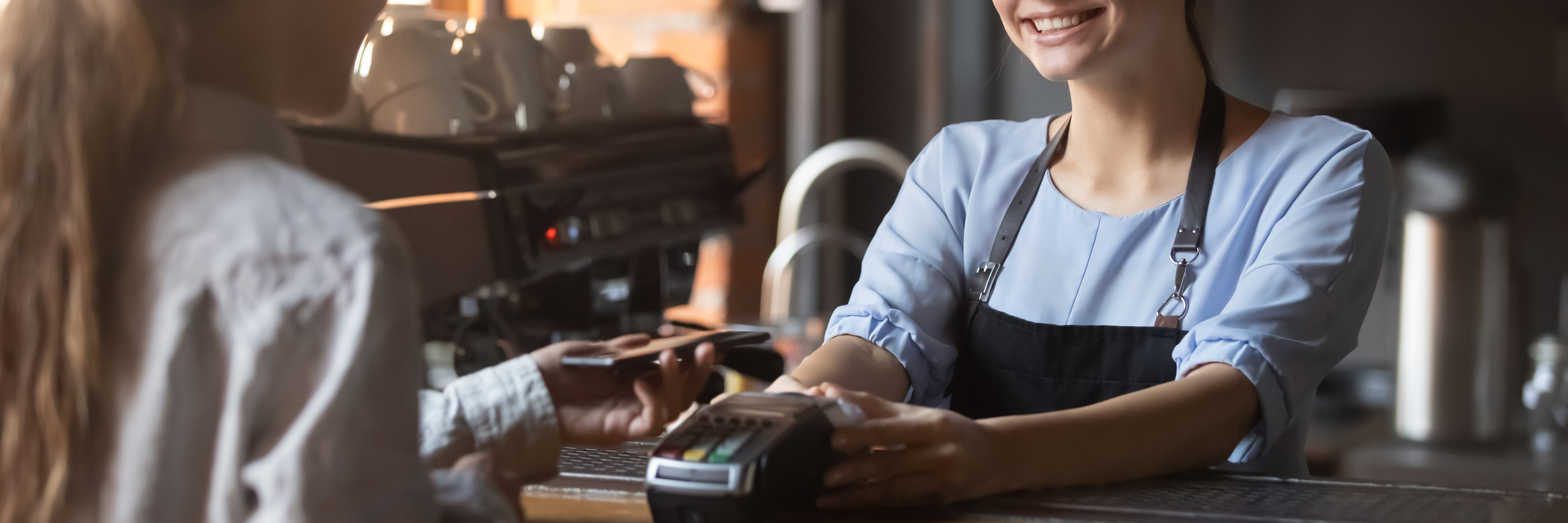 A women paying for a product from a small business