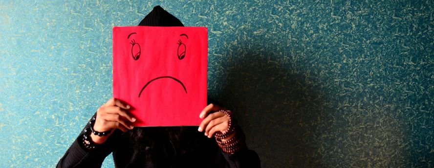 Person Holding Red Cardboard With Sad Face Anxiety Depression Low Mood