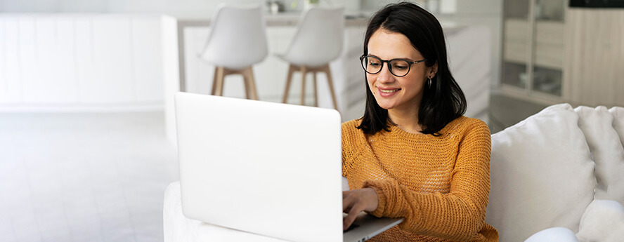 Women online shopping on laptop at home