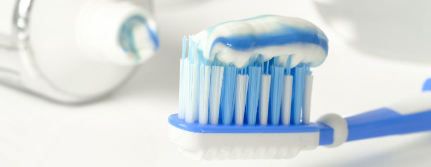 Blue And White Toothpaste On Toothbrush For Fresh Breath