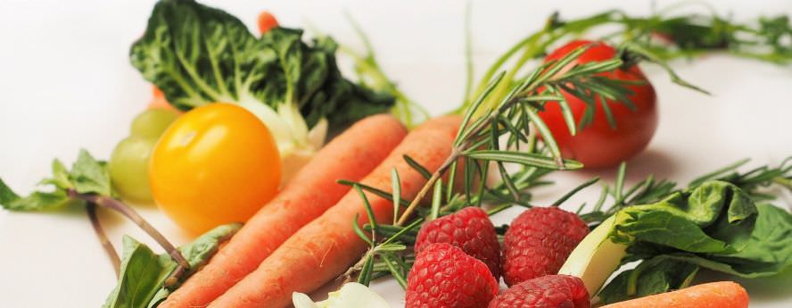 Fresh Food Spring Vegetables And Fruit Ingredients For Healthy Vegan Recipe Carrot Raspberries Tomato Greens