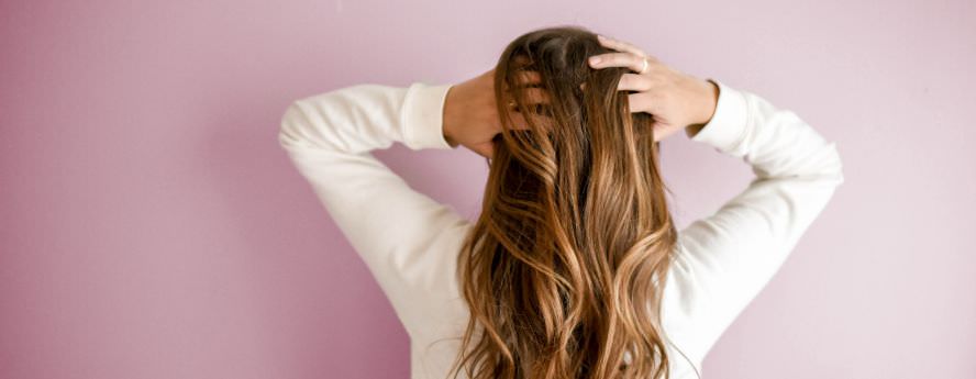 Lady Running Her Fingers Through Her Long Hair